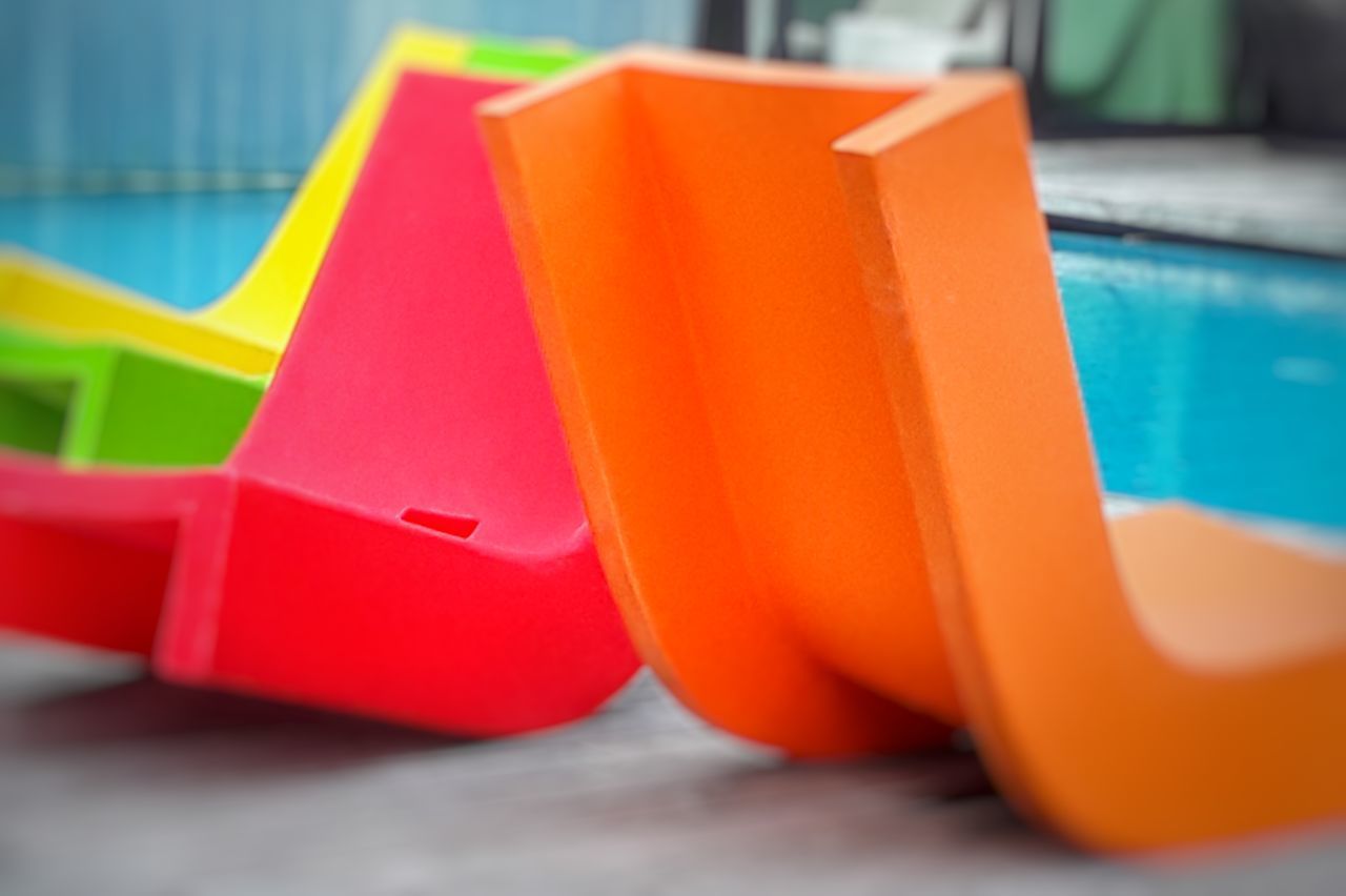 CLOSE-UP OF MULTI COLORED TOY ON TABLE AT HOME