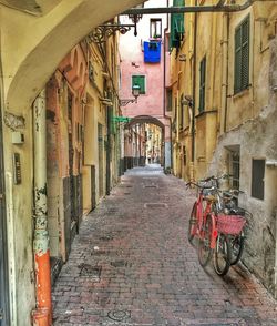 Alley amidst buildings in city