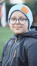 Portrait of young woman wearing hat