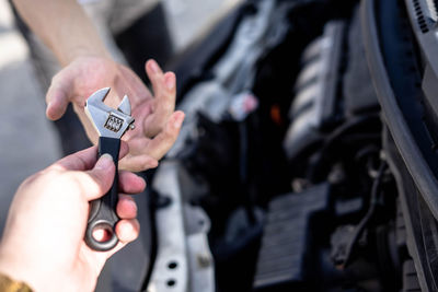 Close-up of hands holding camera