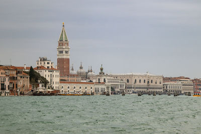 View of buildings against cloudy sky