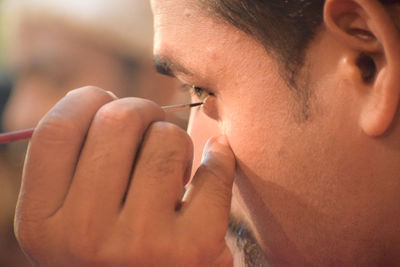 Close-up of man smoking cigarette