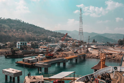 Commercial dock in river by mountain