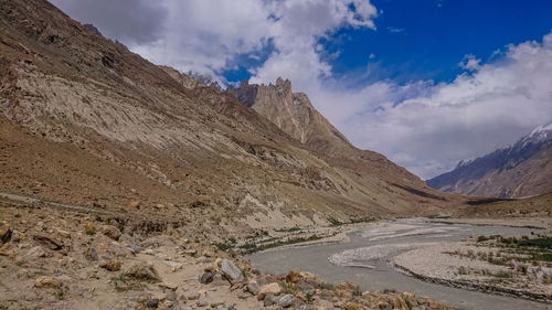 Panoramic view of road amidst mountains against sky