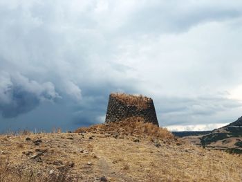 Castle on land against sky