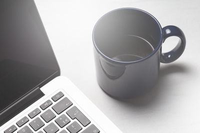 High angle view of coffee cup on table