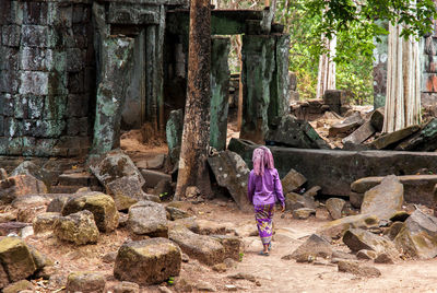 Rear view of girl on tree