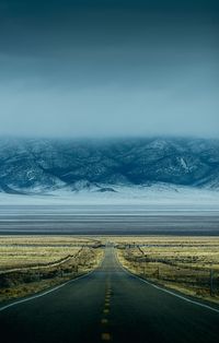 Road by sea against sky