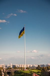 Low angle view of flag against sky