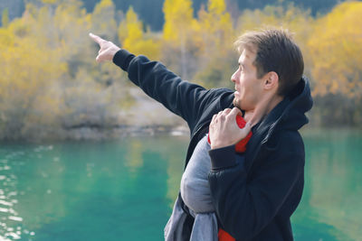 Man standing by lake