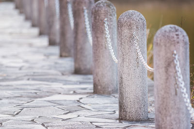 Close-up of cross against stone wall