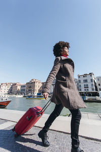 Young tourist woman going for vacation trip