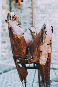 Close-up of rusty metal on wood