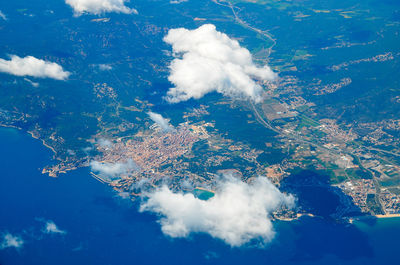 Aerial view of barcelona seen from airplane above the clouds