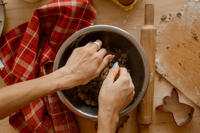 The process of preparing dough for ginger cookies on a light table