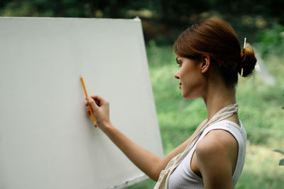 Portrait of young woman looking at camera