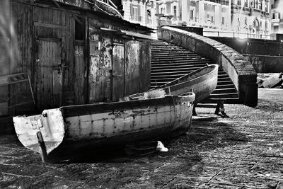 Abandoned boat moored in canal