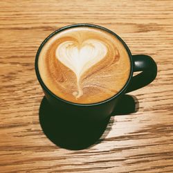 Close-up of cappuccino on table