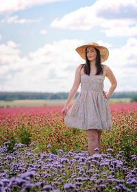 Full length of woman standing on field