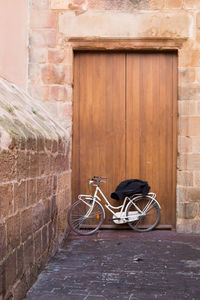 Bicycle leaning against wall