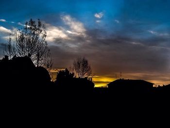 Silhouette of building at sunset