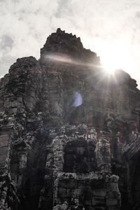 Low angle view of rocks against sky