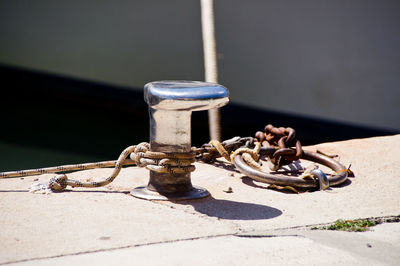 Close-up of rope tied on metal