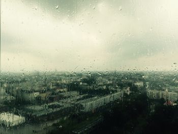 Full frame shot of wet glass window in rainy season