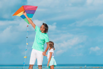 Umbrella on sea against sky