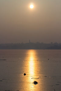 Scenic view of sea against sky at sunset