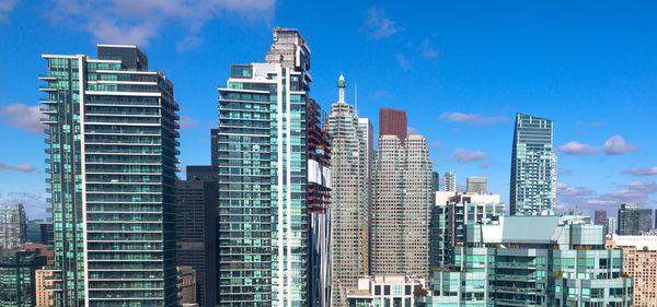 Low angle view of buildings against blue sky