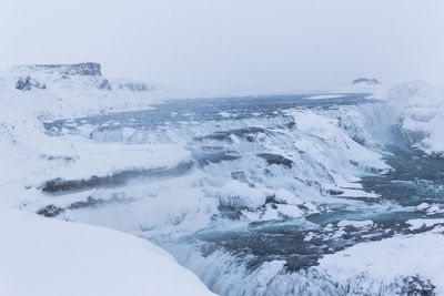 Scenic view of snowcapped landscape against sky