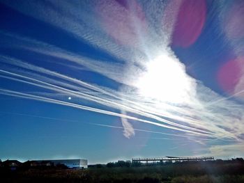 Low angle view of vapor trail in blue sky