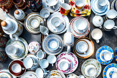 Directly above shot of crockery for sale at market stall