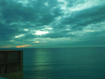 Scenic view of sea against storm clouds