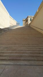 Low angle view of building against clear blue sky