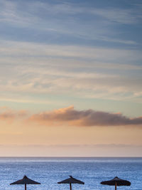 Colored clouds at sunrise over the sea