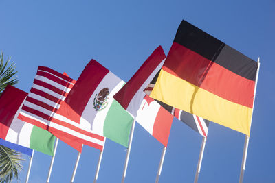 The national flags of italy, england, canada, mexico, united states, and germany flying 