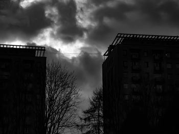 Low angle view of building and trees against sky