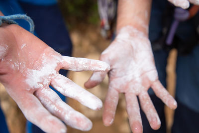 Cropped image of people with messy hands