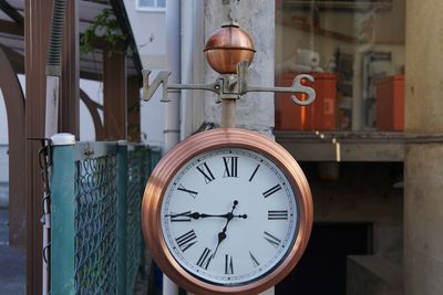 Close-up of wall clock outdoors