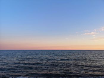 Scenic view of sea against clear sky during sunset