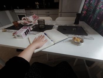 Midsection of woman holding food at home