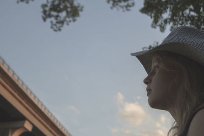 Low angle view of woman against sky