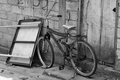 Bicycle parked against wall