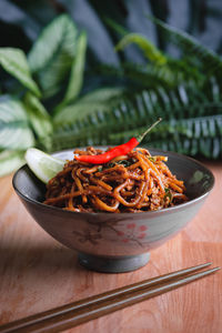 Noodles in bowl on table