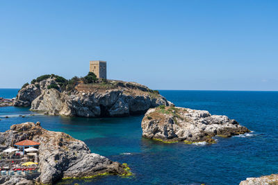 Scenic view of sea against clear blue sky