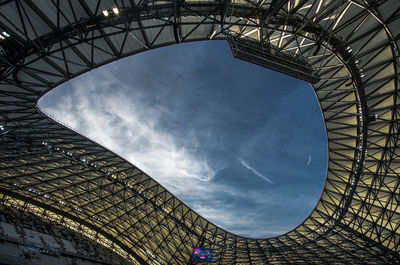 Low angle view of tower against cloudy sky