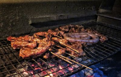 High angle view of meat on barbecue grill