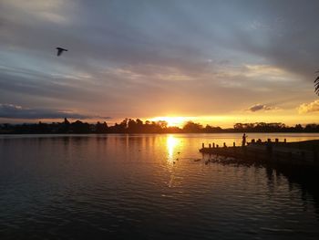 Scenic view of lake rotoroa against sky during sunset